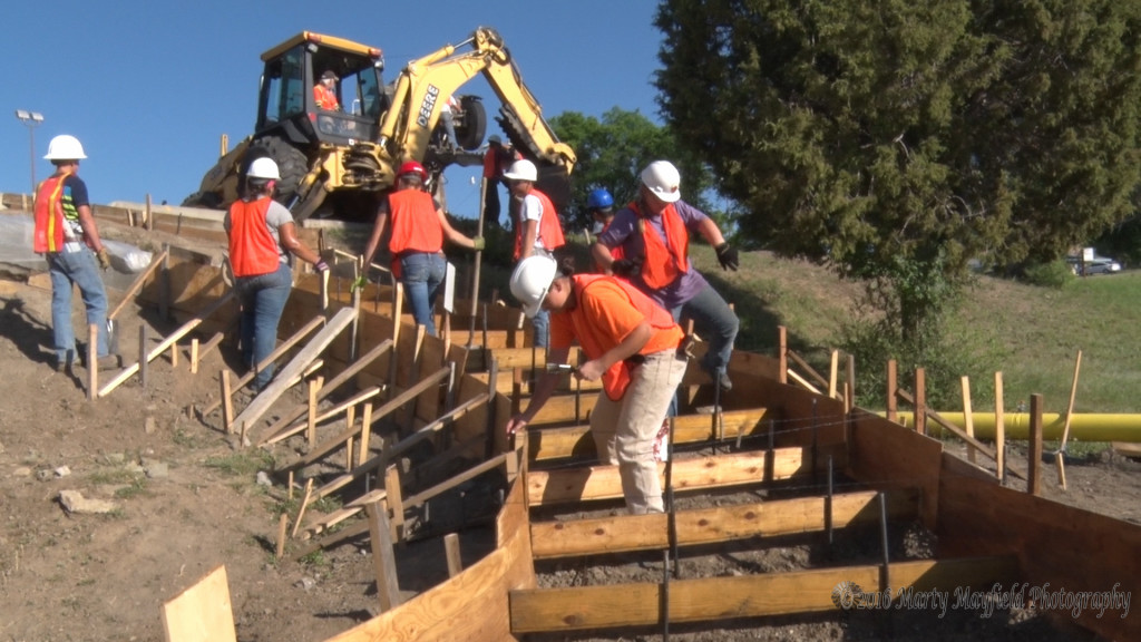 RHS YCC projects are under way at the Raton High School, here the students are preparing forms for the new stairway from the lower parking lot to the upper parking lot on the north side of the high school.