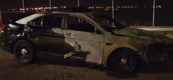 State Police vehicle burns after being struck while jump starting another vehicle
