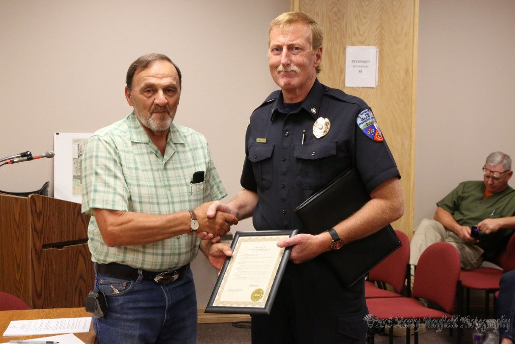 RFES Chief Jim Matthews receives the proclamation from Commissioner Don Giacomo on a job well done for the July 4th fireworks