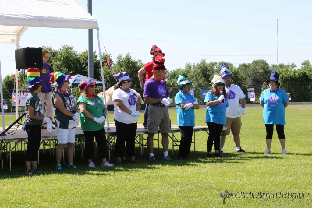 The 2016 Relay for Life Event Leadership team L to R: Mercy Swanson, Jami Esquibel, Diana Alderette, Rebecca Hoy, Eric Armstrong, Nancy Valdez, Liz Tafoya, Manual Luna ACS, Amelia Vigil Vanna Tapia on Stage with Laura Robinson who sang the National Anthem