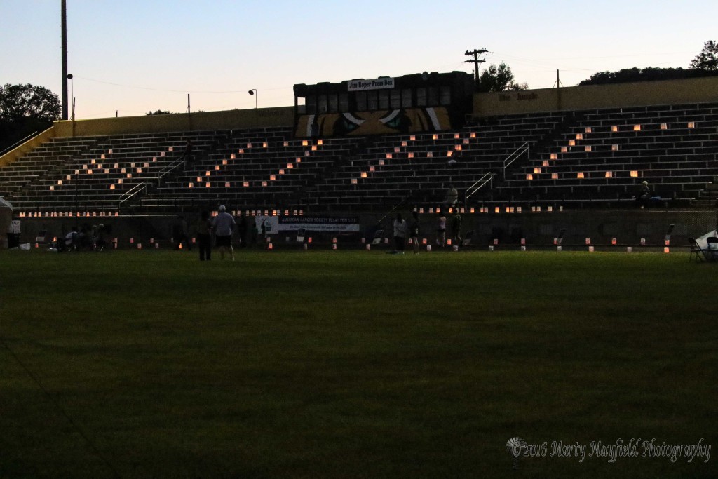 Hope starts to glow on the stadium bleachers Saturday night at the 2016 Relay for Life