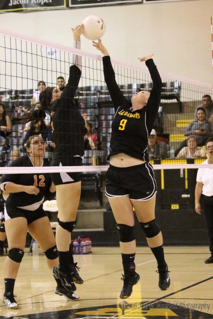 Melanie Lujan and Annalisa Miller tangle at the net as Miller goes for the block during during the RHS Tourney held in Tiger Gym Thursday evening.