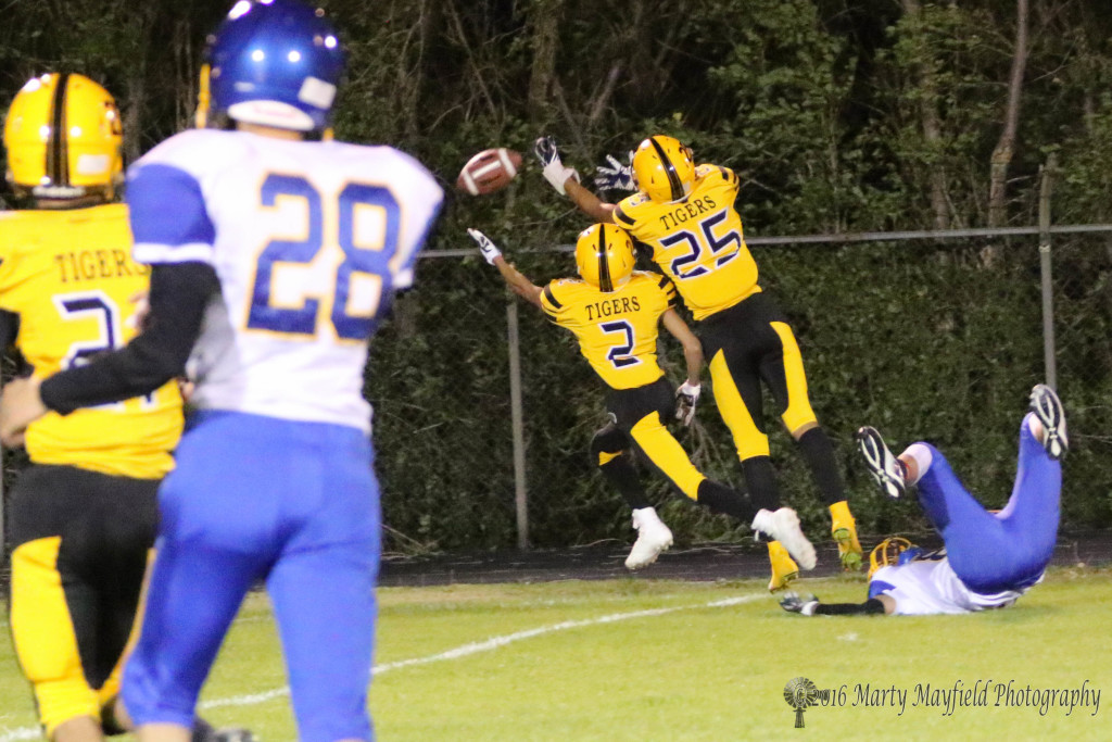 Just put of reach as both Richie Acevedo and Jonathan Cabriales reach for the pass after the Cuba wide receiver falls down 