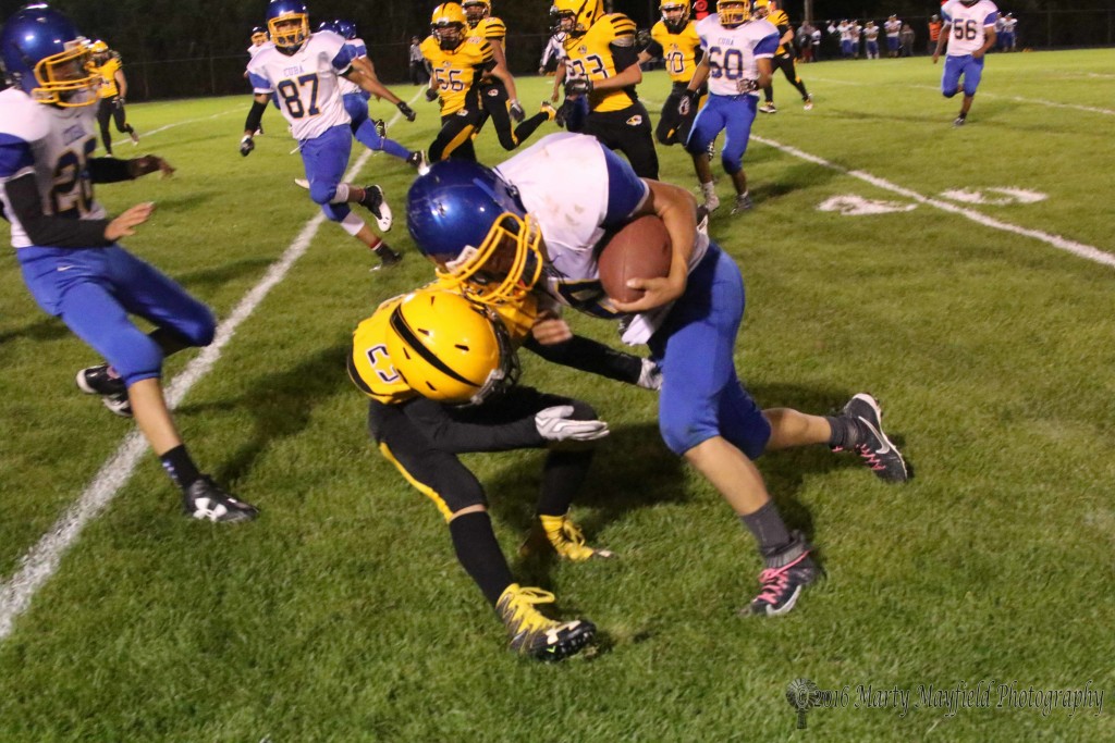 The JV players took to the field Friday night, here Dante Romero takes the hit and makes the tackle