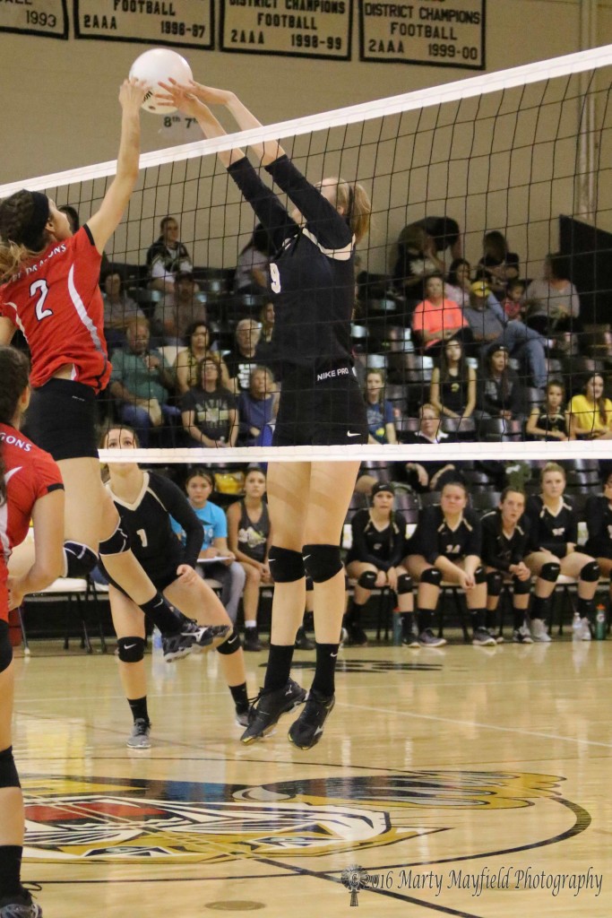 Alina Pillmore just misses the block as Ariana Rodriguez's hit goes left of Alina's hands