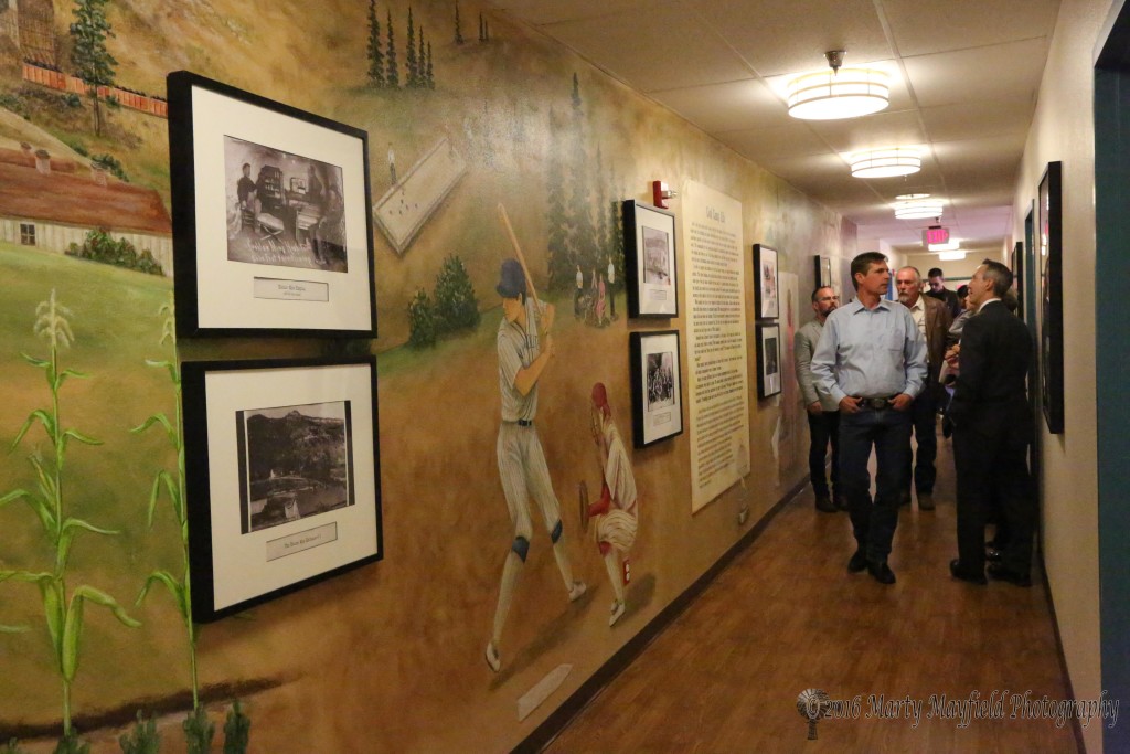 Senator Heinrich tours the halls of the Long term facility which has been decorated with mining artwork.