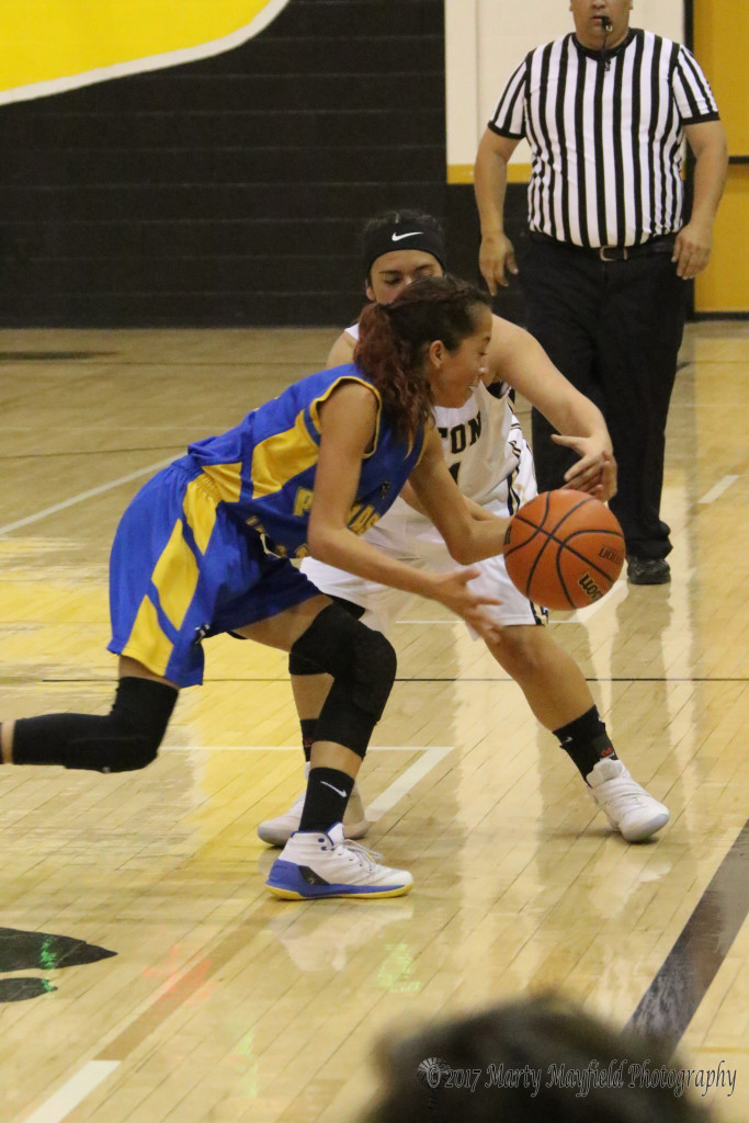 Ashley Zamora gets a hand on the ball for the steel as Becca Muniz brings the ball down the court 