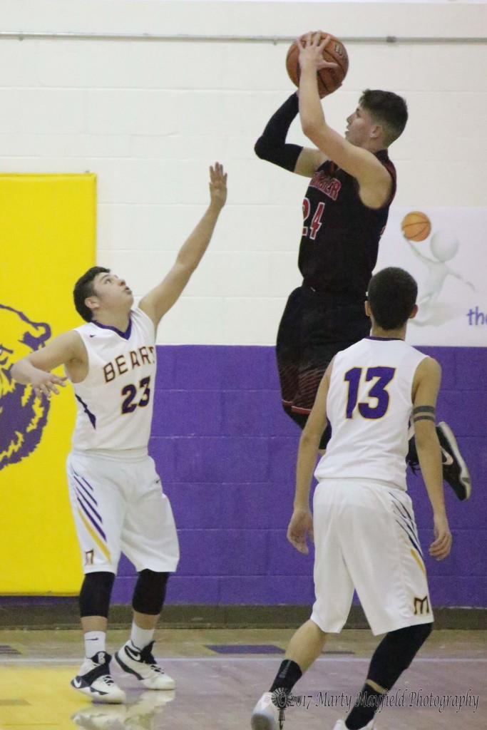 Isaiah Garcia goes up for two of his 12 points during the District 5A championship game