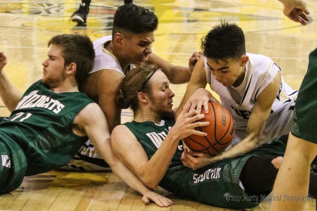 Its a scramble on the floor for the ball as Jesse Espinoza and Sundy Khalsa work to gain control of the ball as Austin Jones and Rise Miller get pushed out