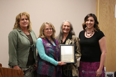 Michael Ann Antonucci, Paula Cacciatore andTaryn Giacomo accept the Equal Pay Proclamation from Commissioner Lindé Schuster. 