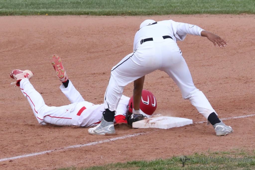 Jonathan Cabriales makes the tag at first, the call however was safe for Jorge Morales in the first pick off attempt of the game by Cole Medina