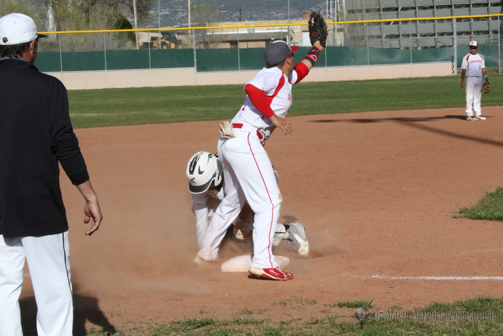 Jonathan Cabriales slides to third again ahead of the ball for the steal during Thursday's district game with Monte Del Sol
