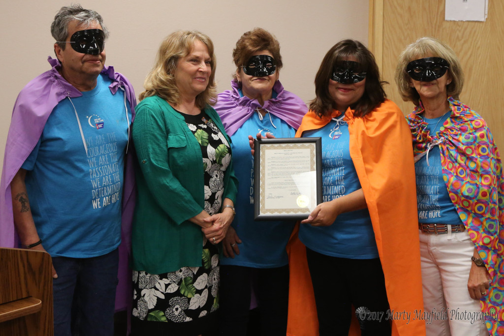 Kenny Cruz, Anita Vigil, Liz Tafoya and Mercy Swanson accept the Proclamation for this year's Relay for Life from Commissioner Lindé Schuster.