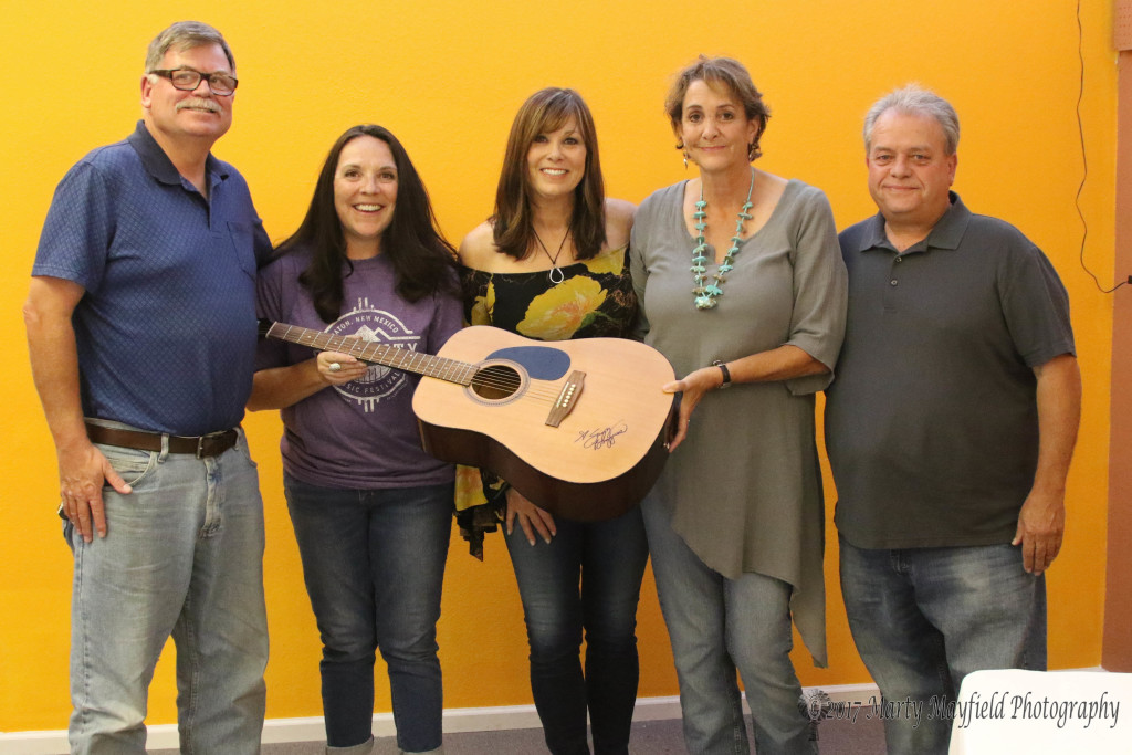 Carl Hickman, Brenda Ferri Suzy Bogguss, Wendy Hickman and Jackie Phillips display the autographed guitar that Wendy won for the 3rd Annual Gate City Music Festival in the KCRT contest.