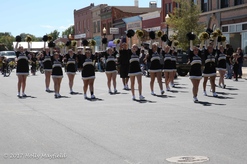 RHS Cheer cheers their way down First Street Friday afternoon during the Homecoming Parade.