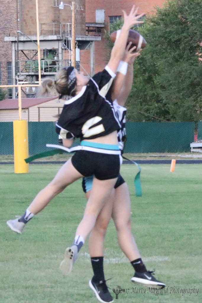 Sr Camryn Mileta breaks up a pass to Jr Jadyn Walton during the powder puff ball game Wednesday evening in the Jungle.