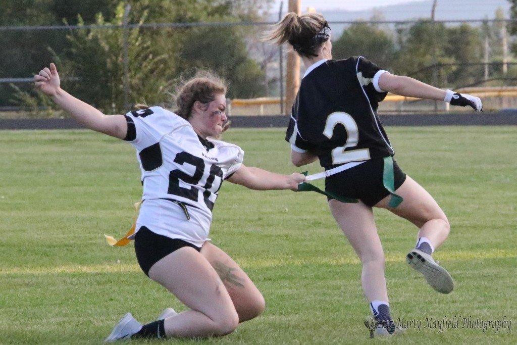 Returning the favor Jr Jadyn Walton makes the tackle on Sr Camryn Mileta during the Powder Puff football game Wednesday evening.