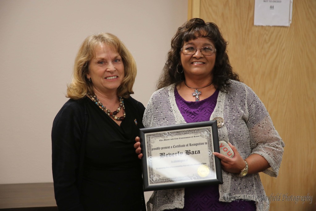 Beverly Baca was presented the You Rock award by Commissioner Lindé Schuster for her work on a fund raiser for a young child in need of medical treatment. 