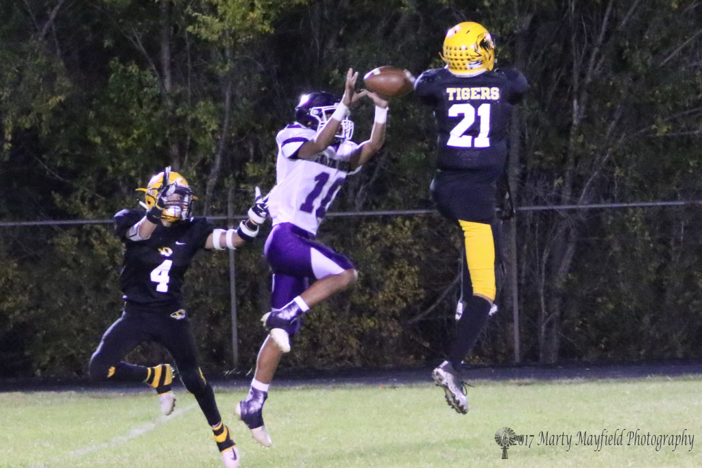 Almost an interception by Daniel Esquivel as the pass goes through Gabe Martinez hands in the second half of the district game with Santa Rosa Friday night in the Jungle