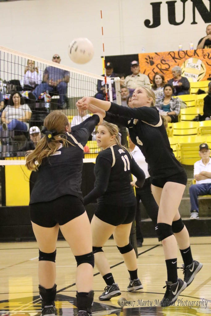 Ginger Baird and Jadyn Walton go for the hit while Kerrigan Weese looks on ready to assist during the match with Santa Fe Prep Saturday afternoon.