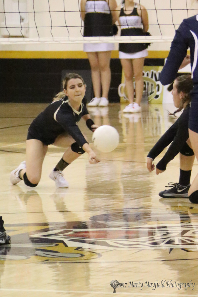 Camryn Mileta takes to the knee for the hit as Halle Medina is ready for the assist who gets the ball sooner than she expected for the point for Prep.
