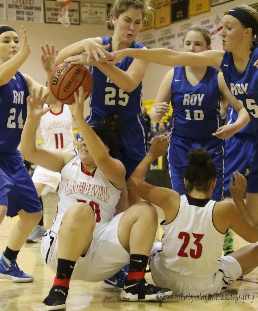 2 of 2 Alicia Arias(30), with the ball, was going up for the shot but ends up surrounded by a whole host of Lady Blue, Kindel Smith(24) Baylee Horn(25), Kaylee Lewis(10) and Hayley King(35) as Shylow Saenz(23) finds herself in the middle of things during the 2107 Cowbell Tourney. 