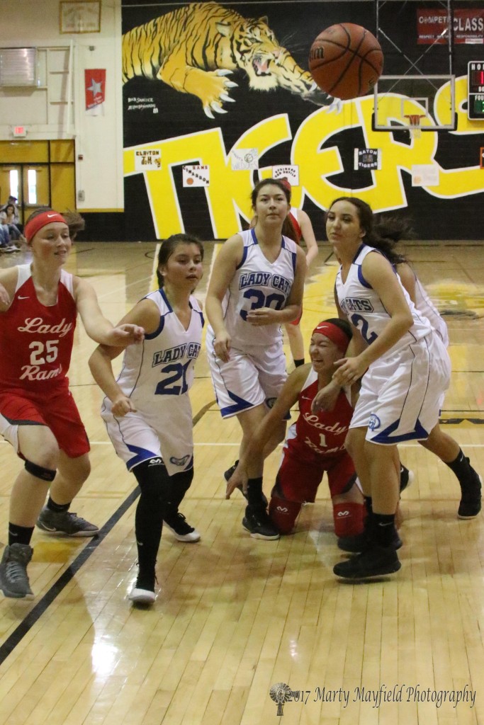 Whoops there goes the ball as Angel Gonzales hits the floor surrounded by a host of Lady Wildcats Kiana Passino(21), Sasha Martinez(30), Anastasia Gonzales and Arianna Ortega with Analisa Maloney(25) going for the ball during the 81st Annual Cowbell Tourney 