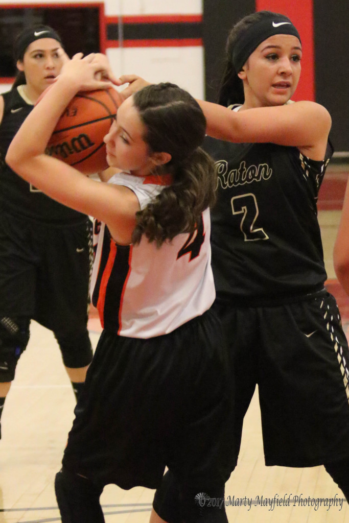 Teyah Rodriguez(4) and Natausha Ortega tie up the ball during the 2017 Cowbell in Springer Wednesday evening. 