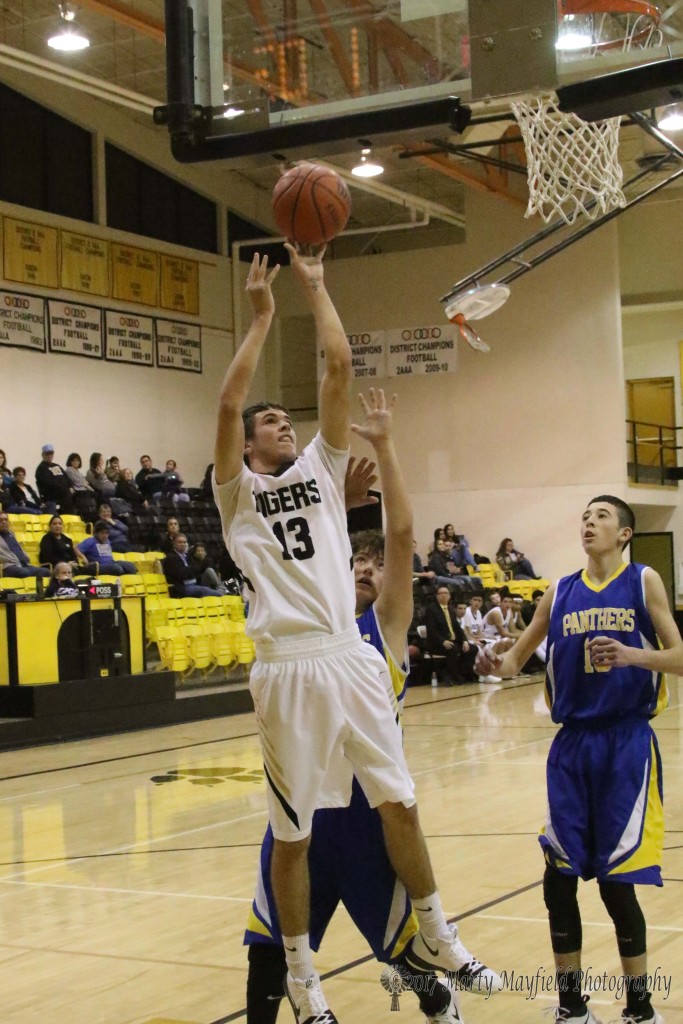 Aden Vanderwater goes in for the easy shot and two of his 21 points on the evening against Peñasco Tuesday evening.
