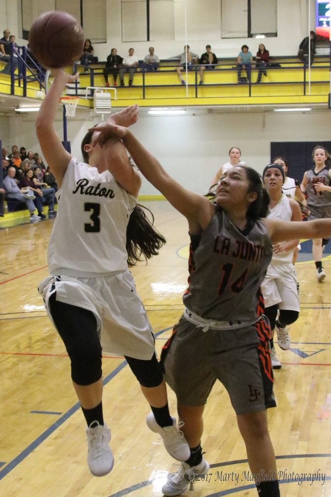 Danella Zamora draws the foul as she gets a hand on Baylor Walton as she goes up for the lay-up Friday night in Scott Gym during the TSJC Tourney.