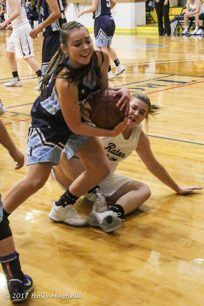 Jessielyn Vallejos makes the grab as Kerrigan Weese tries to take it away Saturday evening in Scott Gym at the 2017 TSJC Tourney. 