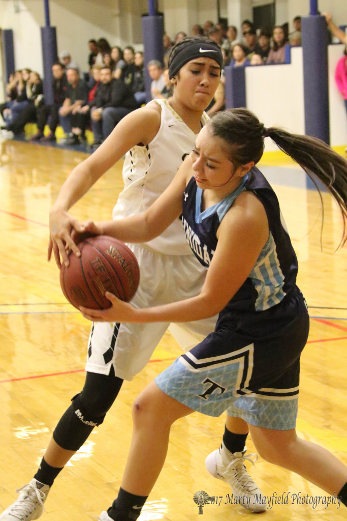 1 of 2 Autumn Archuleta goes for the takeaway after the ball is inbound to Jamielynn Vellejos Saturday evening at the 2017 TSJC Tourney. 