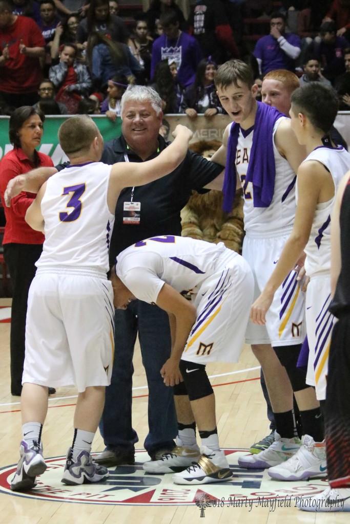 Coach Brazil celebrates one of his state titles with the boys. 