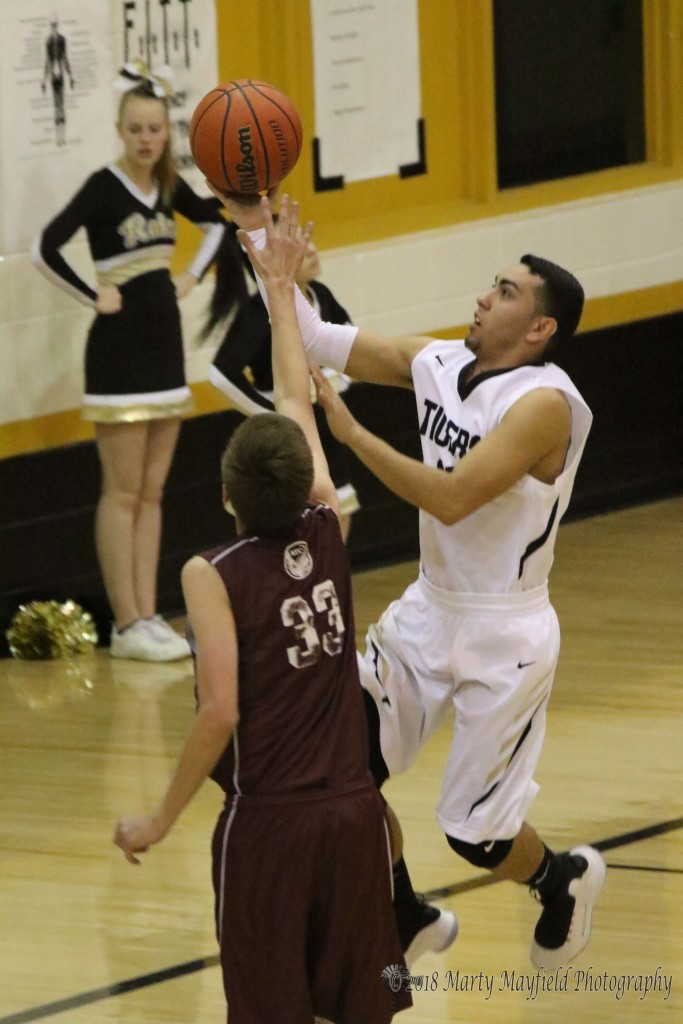 Dustin Segura drives to the basket in the fourth quarter of the district game against ATC Thursday evening.