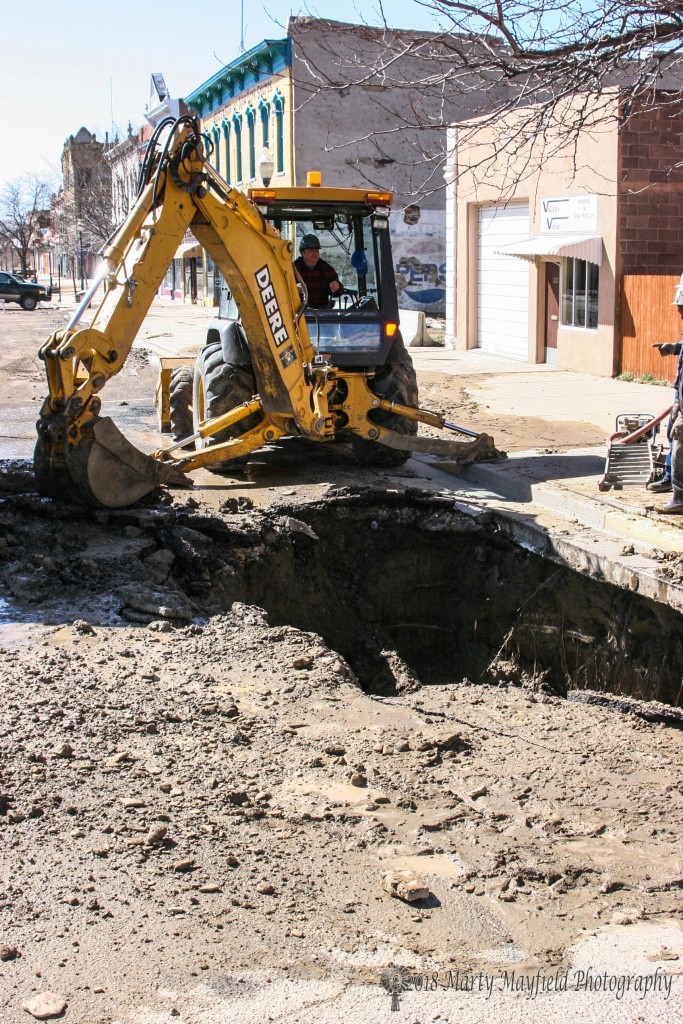 Raton Water Works personnel work on a water leak on First Street. 