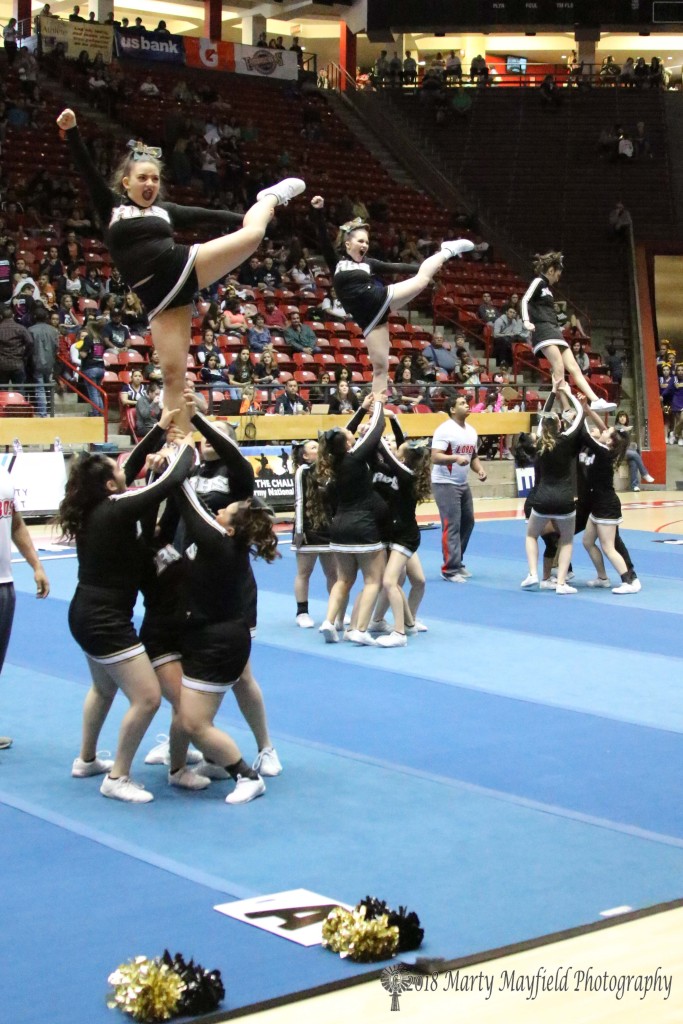 The RHS cheer team performs one of their more difficult stunts Saturday morning during their routine in The Pit.