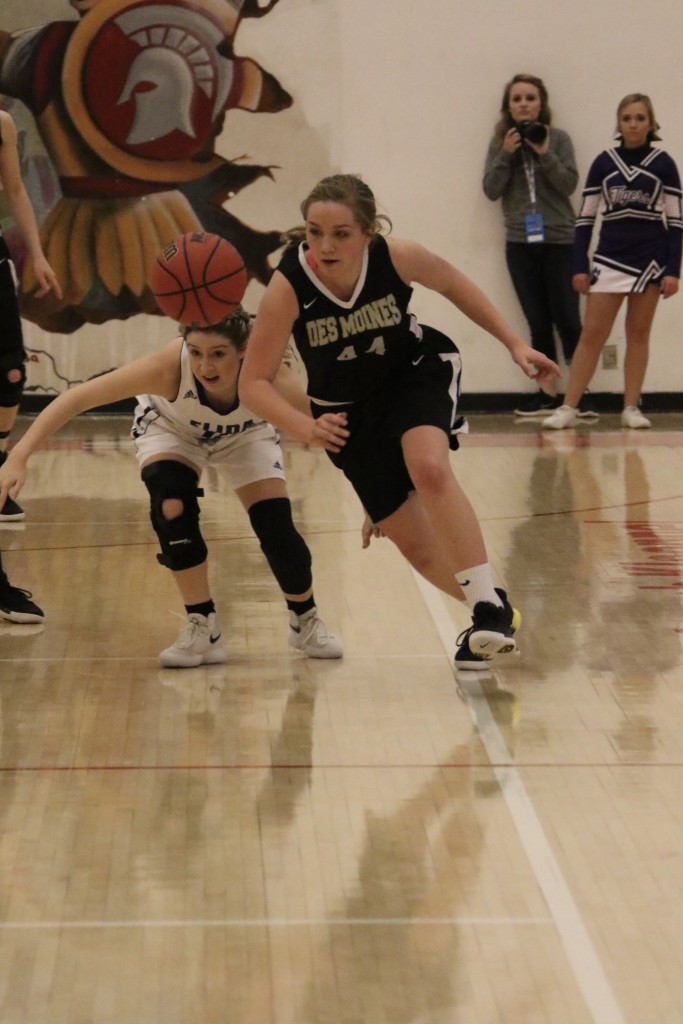 Natasha McDonald taps the ball away from Lacy Ferguson in the second half of the semifinal game in Bernalillo Thursday afternoon 