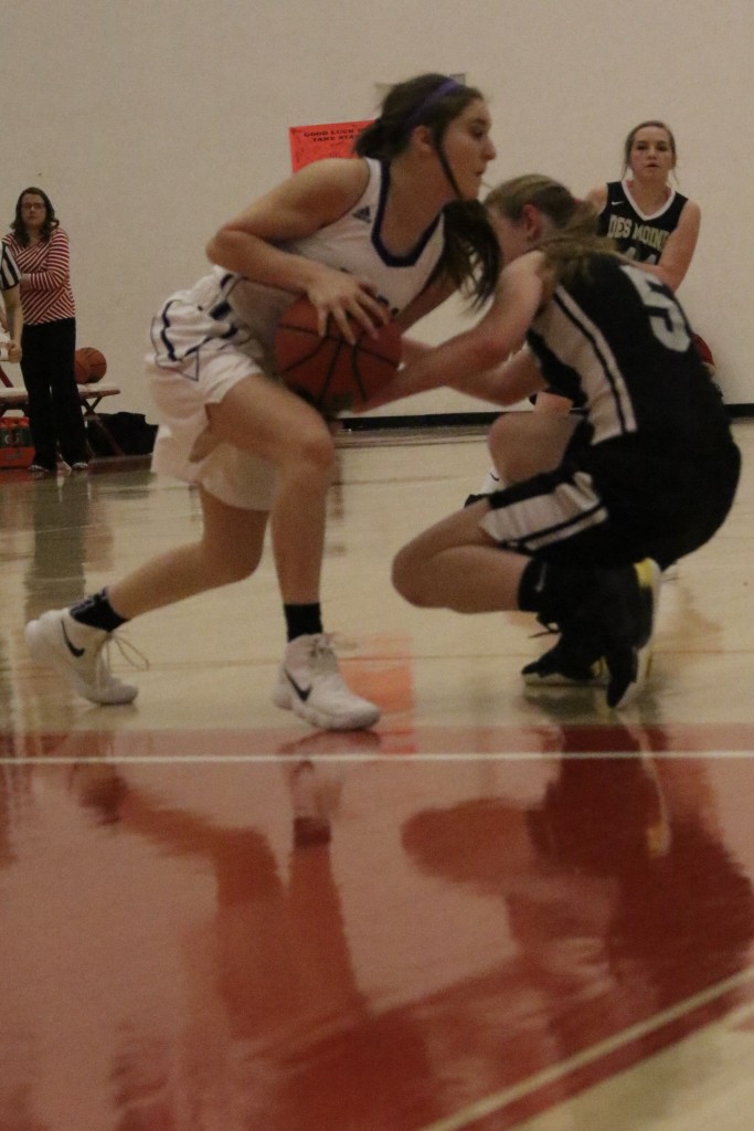 Grace Hall gets a hand on the ball to disrupt the play early in the game with Elida in Bernalillo 