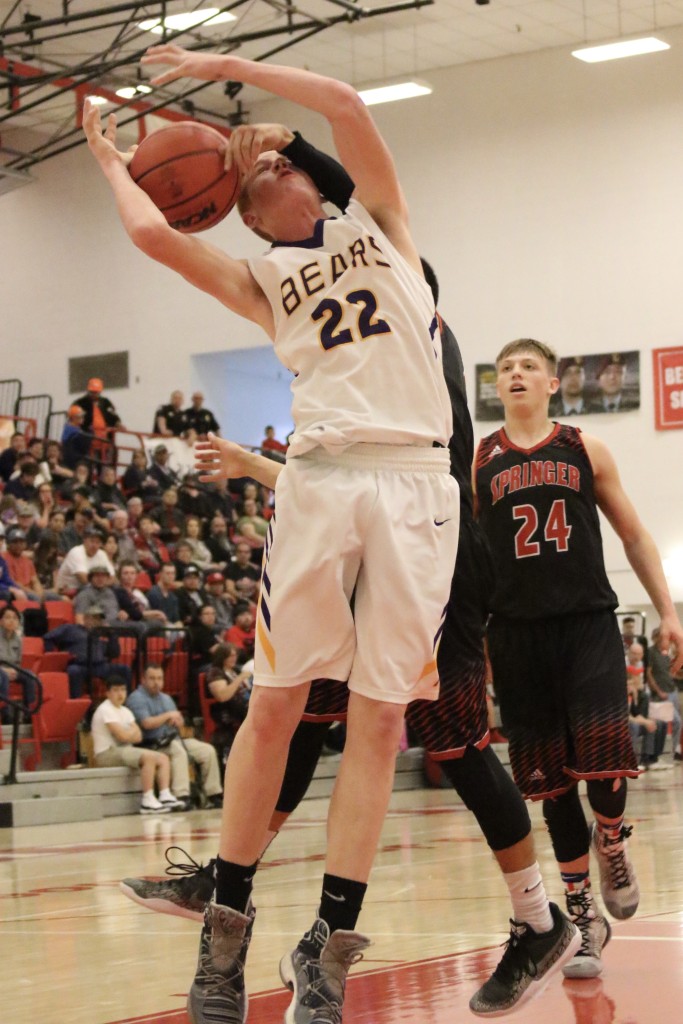 Kaden Riggs goes up for the shot but takes one from Bryon Romero early in the semifinal game in Bernalillo 