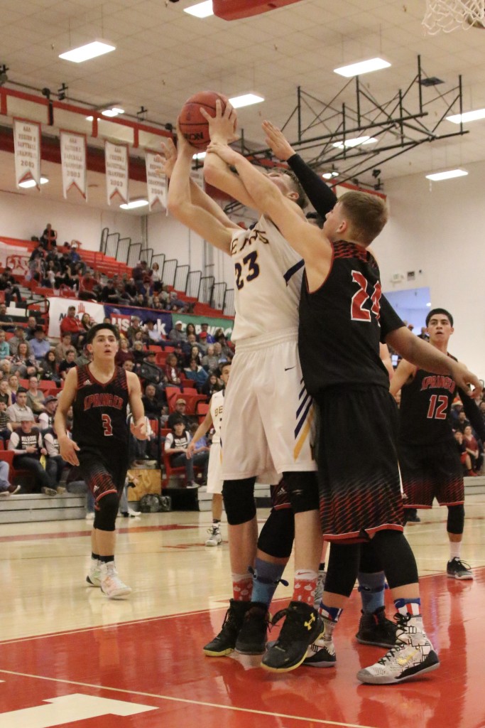 Gabriel Garcia and Chase Casias go after Kolton Riggs as he goes for the shot during the semifinal game in Bernalillo 