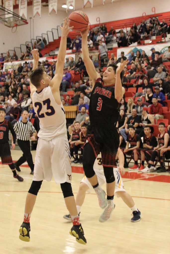 Owen Burton tries to get it above Kolton Riggs but it is once again deflected away during the semifinal game in Bernalillo 