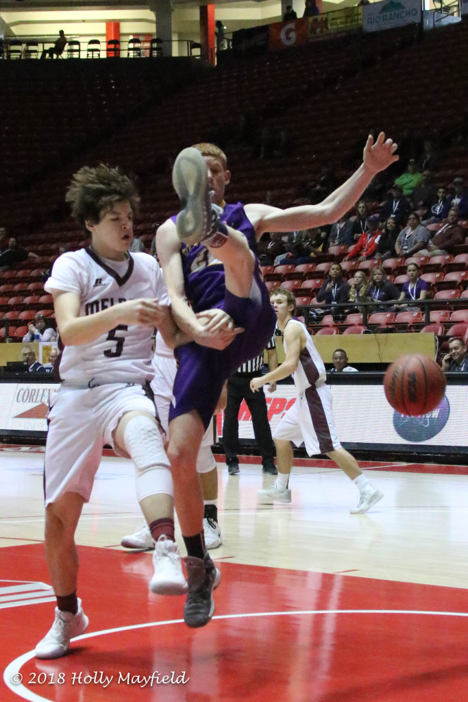 Tate Sorgen and Kaden Rigs tangle as the ball gets loose during the state title game in Albuquerque Saturday morning.