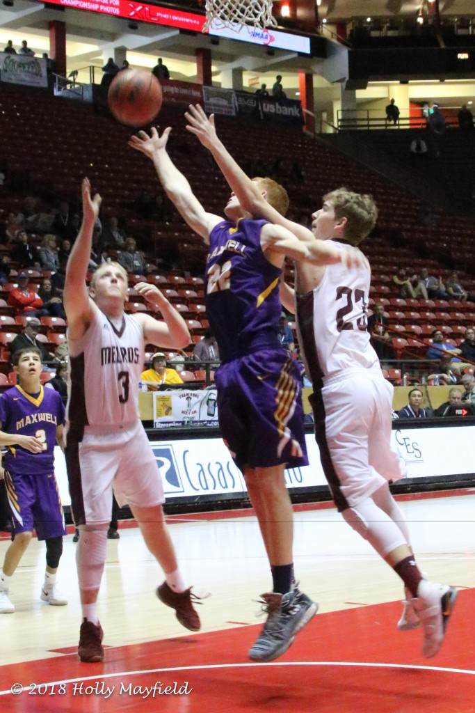 Kaden Riggs just misses the ball as he and Hunter Sorgen go up for the rebound, Blake Devaney would eventually end up with the ball as it goes wide. 