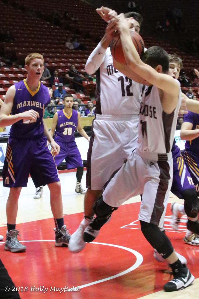 The ball bangs Sterling Sena as he and Jordan Jasso work for the rebound during the state title game Saturday morning in The Pit in Albuquerque.