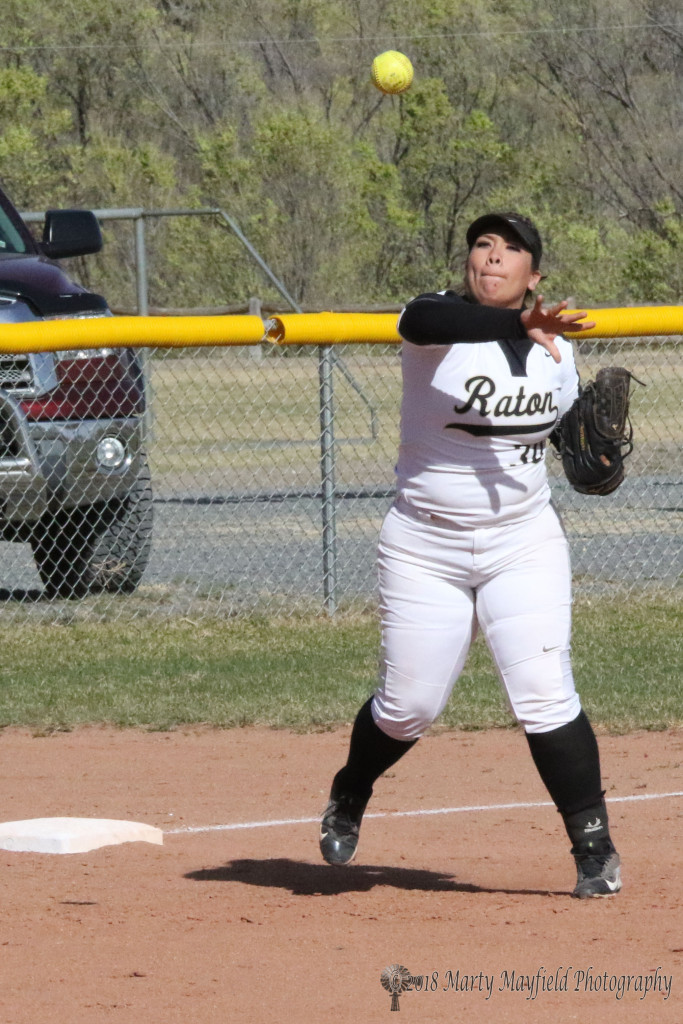 Sydni Silva makes the throw to first for another out as Raton tromps the Mora Rangerettes Tuesday afternoon. 