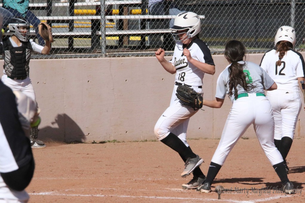 Halle Medina adds another run to the scoreboard for Raton in game two as the girls go for a 19-0 wind over Mora Tuesday afternoon at Jim Wade Field.