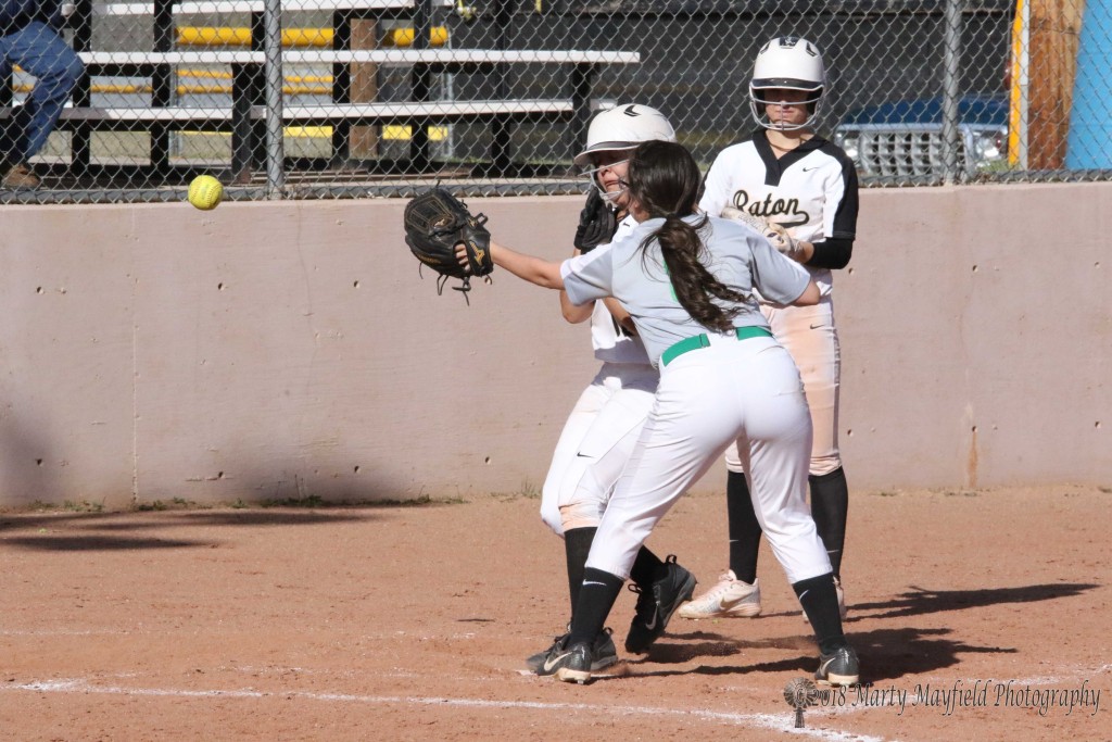 Safe at Home as the throw from the catcher isn't in time as Andie Ortega crosses the plate. 