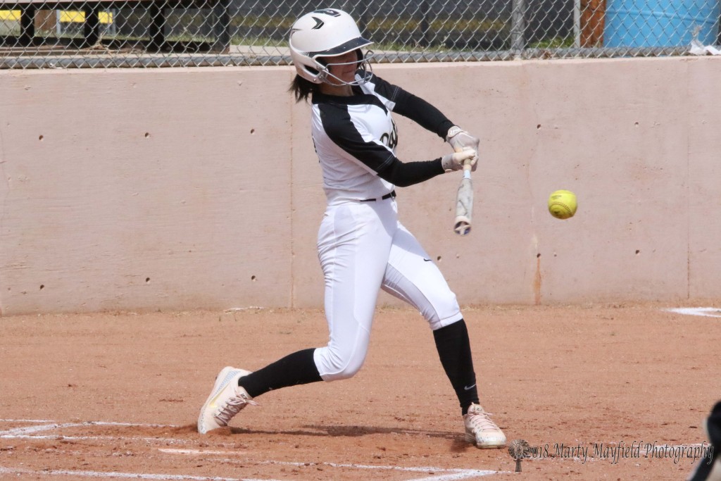 Camryn Mileta makes contact and drives the ball tot he fence for an infield home run Thursday afternoon against Pecos.