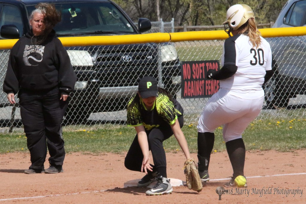 Sydni Silva makes it to third as the ball rolls by Pecos third baseman Alyssa Alcaraz Thursday afternoon at Jim Wade Field.