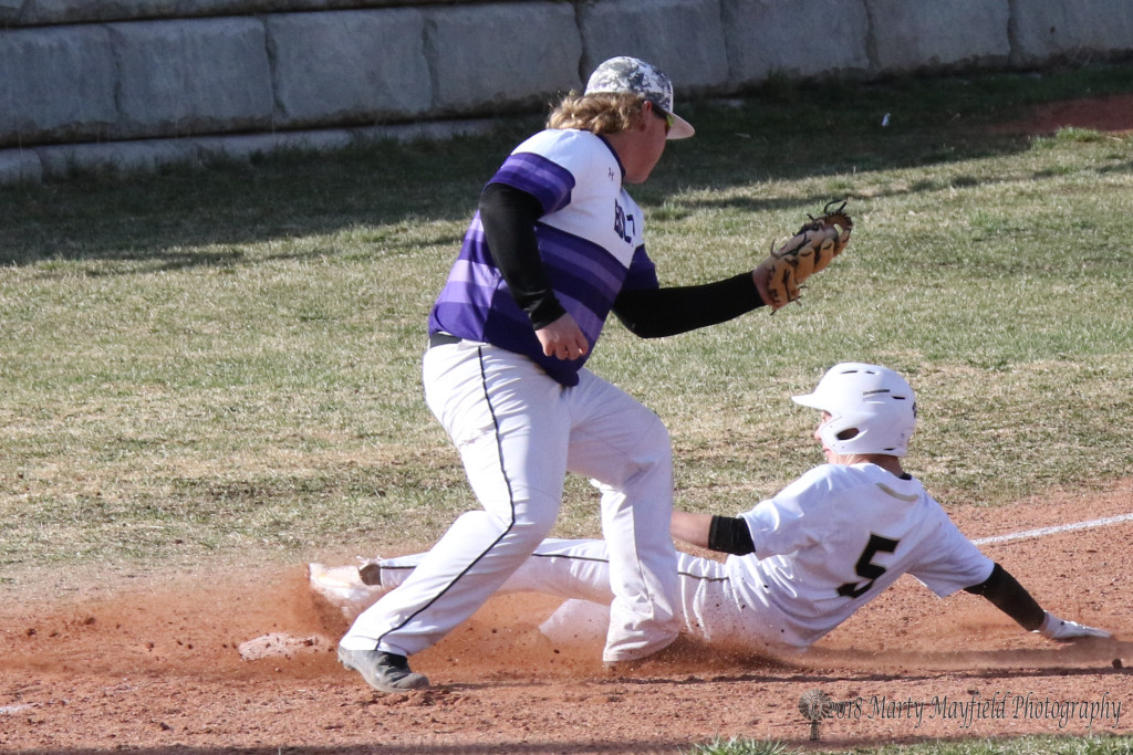 Jasper Hunnicutt steals third after stealing second to move around the bases Tuesday afternoon. 